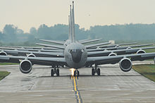The front of several gray aircraft are centered in the image.